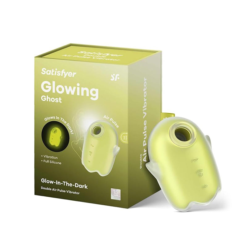 Satisfyer Glowing Ghost lay-on vibrator in neon yellow with glow-in-the-dark design and packaging box.