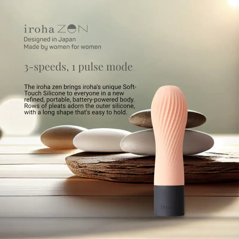 Elegant G-spot vibrator placed beside spa stones in serene setting
