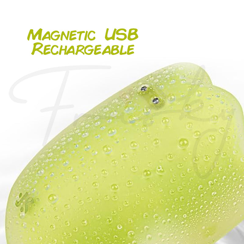 Detailed side view of Glowing Ghost vibrator with magnetic USB charging connectors visible.