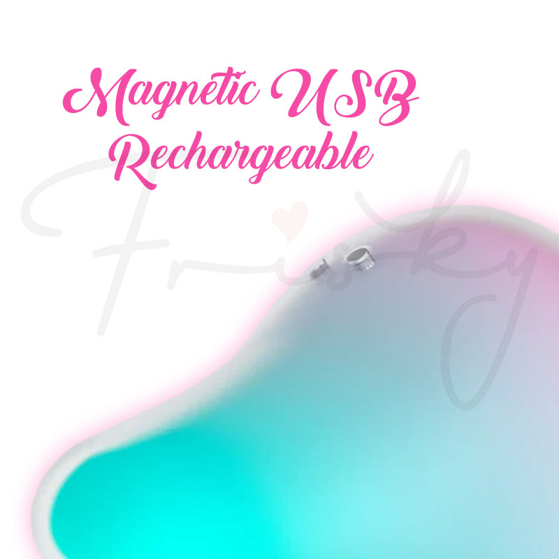 Close-up of Mermaid Vibes pastel vibrator showing magnetic USB charging connectors.