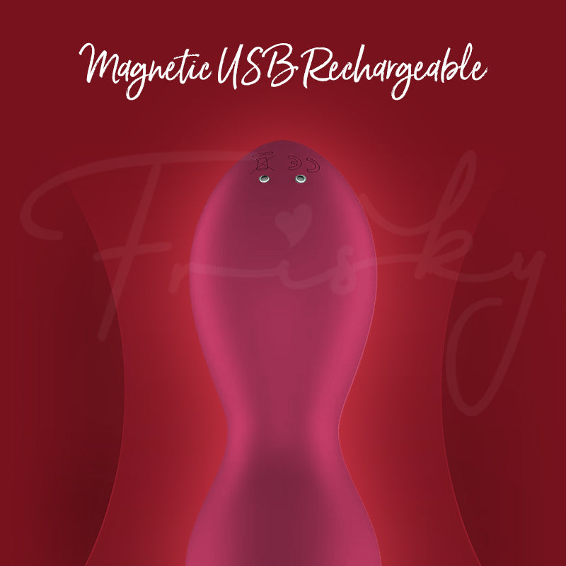 Close-up of Exciterrr vibrator showing magnetic USB charging connectors at the base.