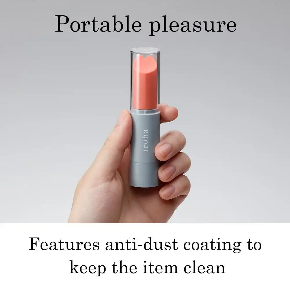 Compact lipstick vibrator with coral tip, designed for discreet personal use