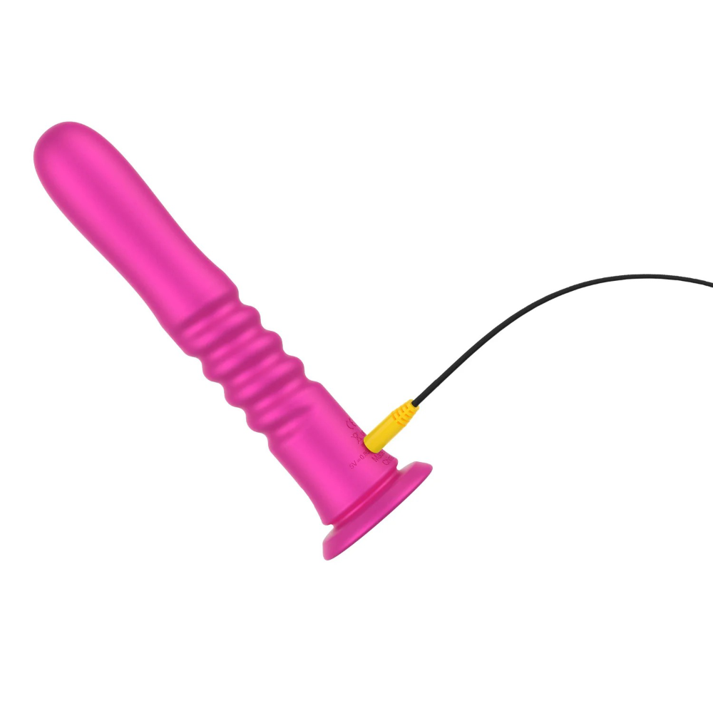 Thrusting dildo connected to charging cable showing power port placement