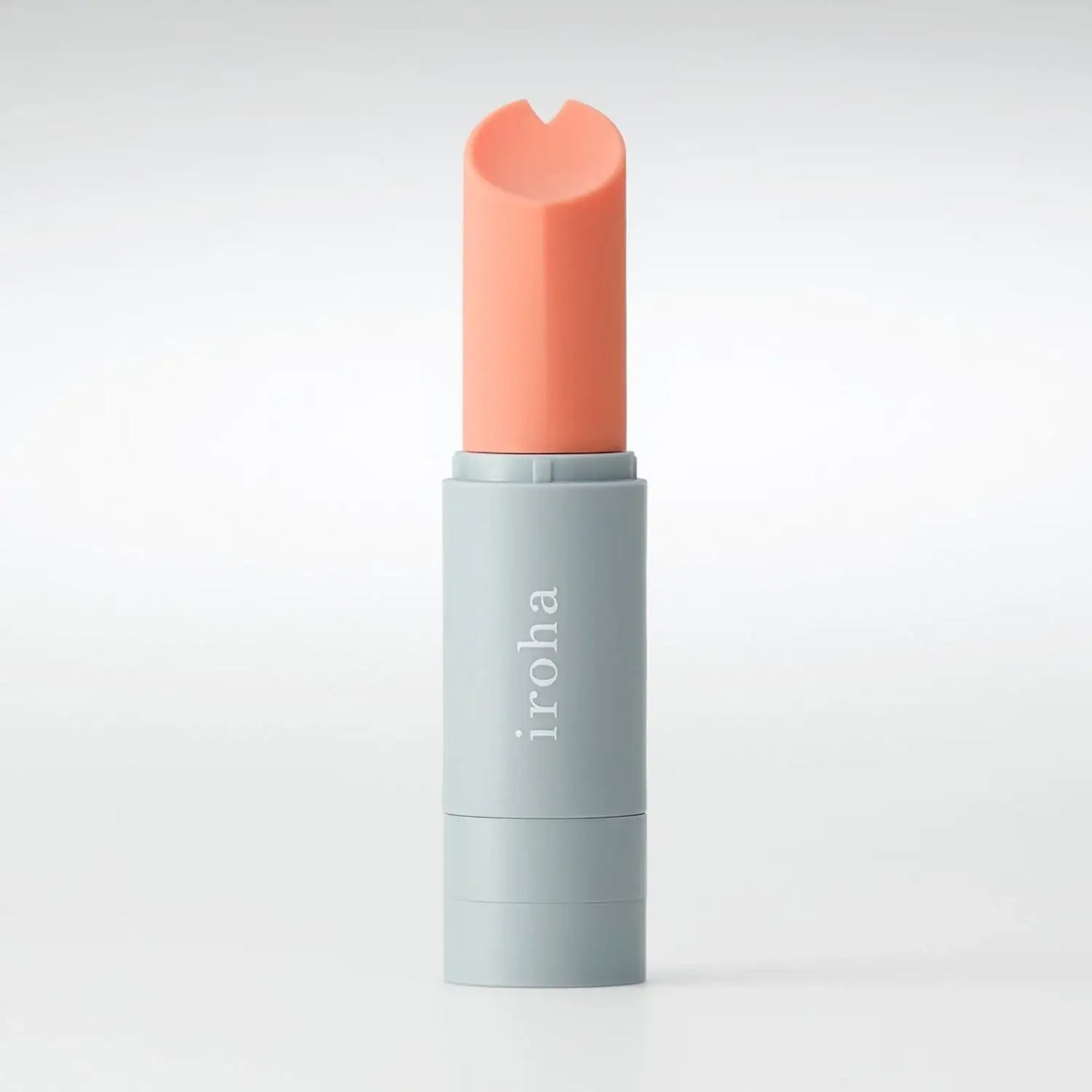 Front view of lipstick vibrator standing upright with minimalist modern design