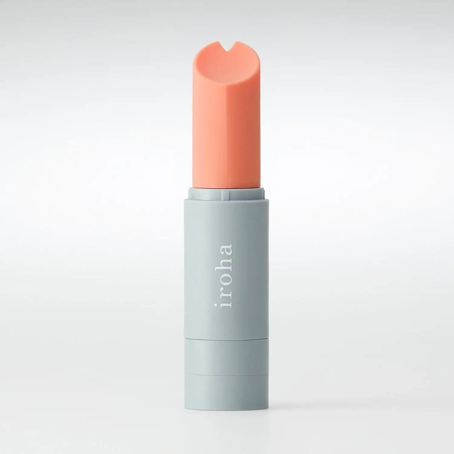 Front view of lipstick vibrator standing upright with minimalist modern design