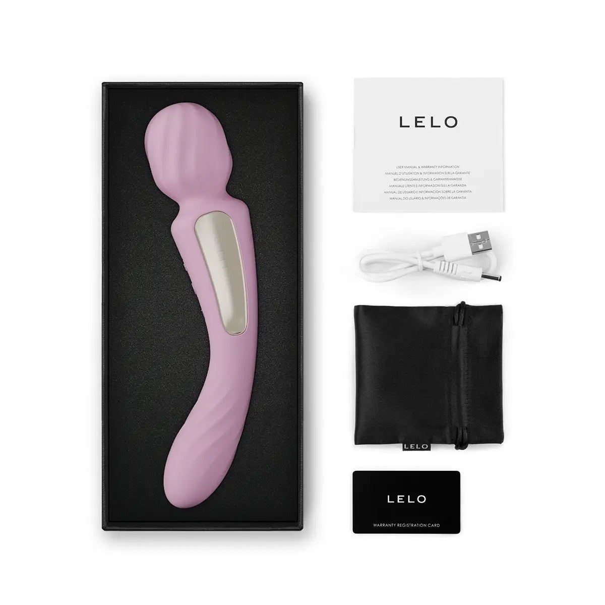 Lelo Switch soft pink double-sided wand vibrator in box with included items: manual, lubricant sachet, USB charging cord, satin pouch, and warranty card.