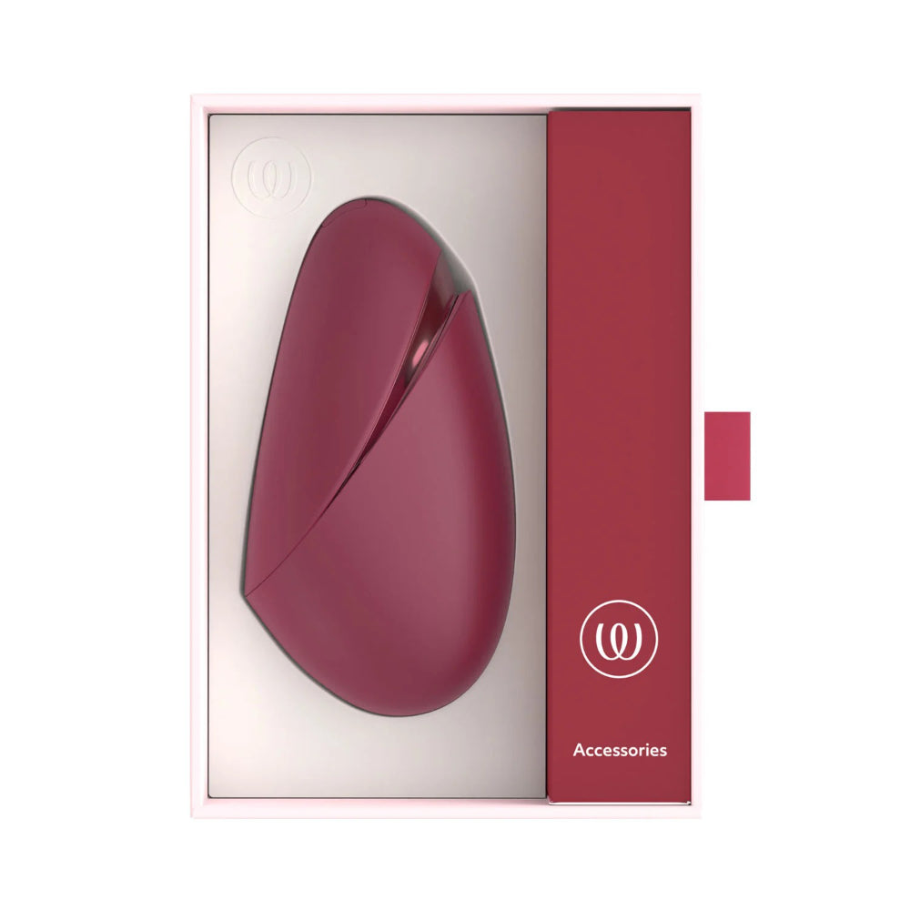 Womanizer Next Liberty displayed beside its premium retail packaging and official branded box.