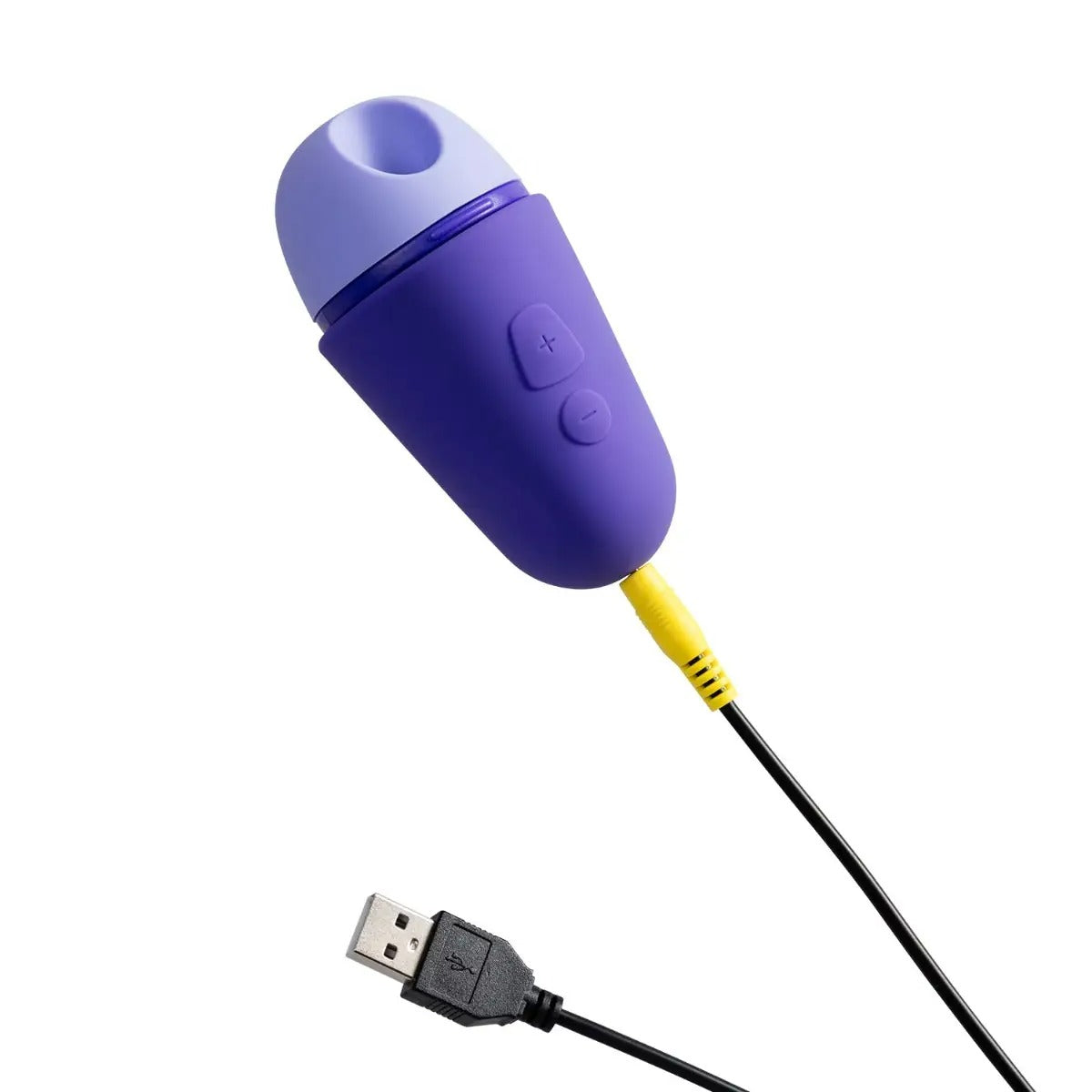 ROMP Free X clitoral stimulator connected to its USB charging cable for recharging.