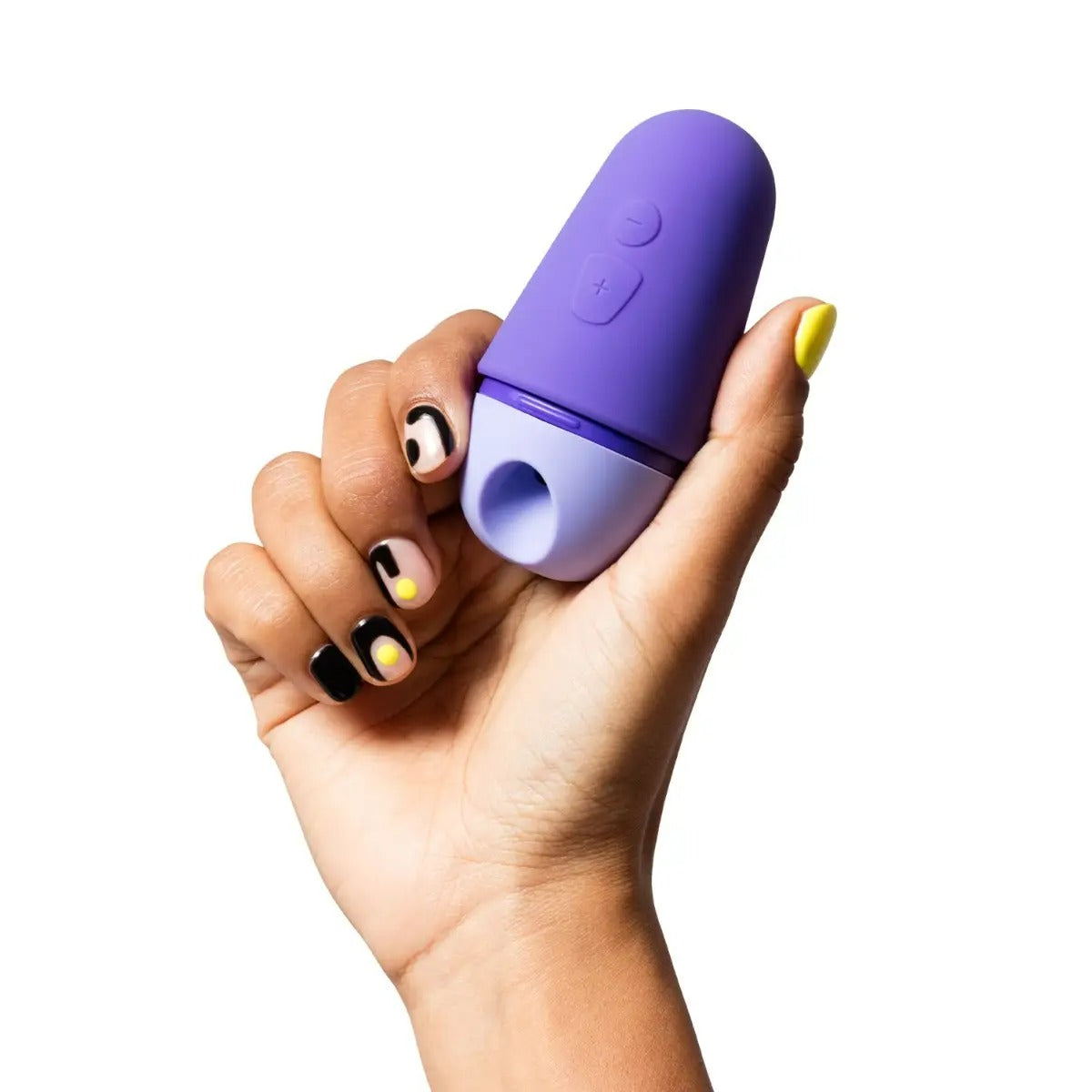 Hand holding ROMP Free X to show its compact, ergonomic, and travel-friendly design.