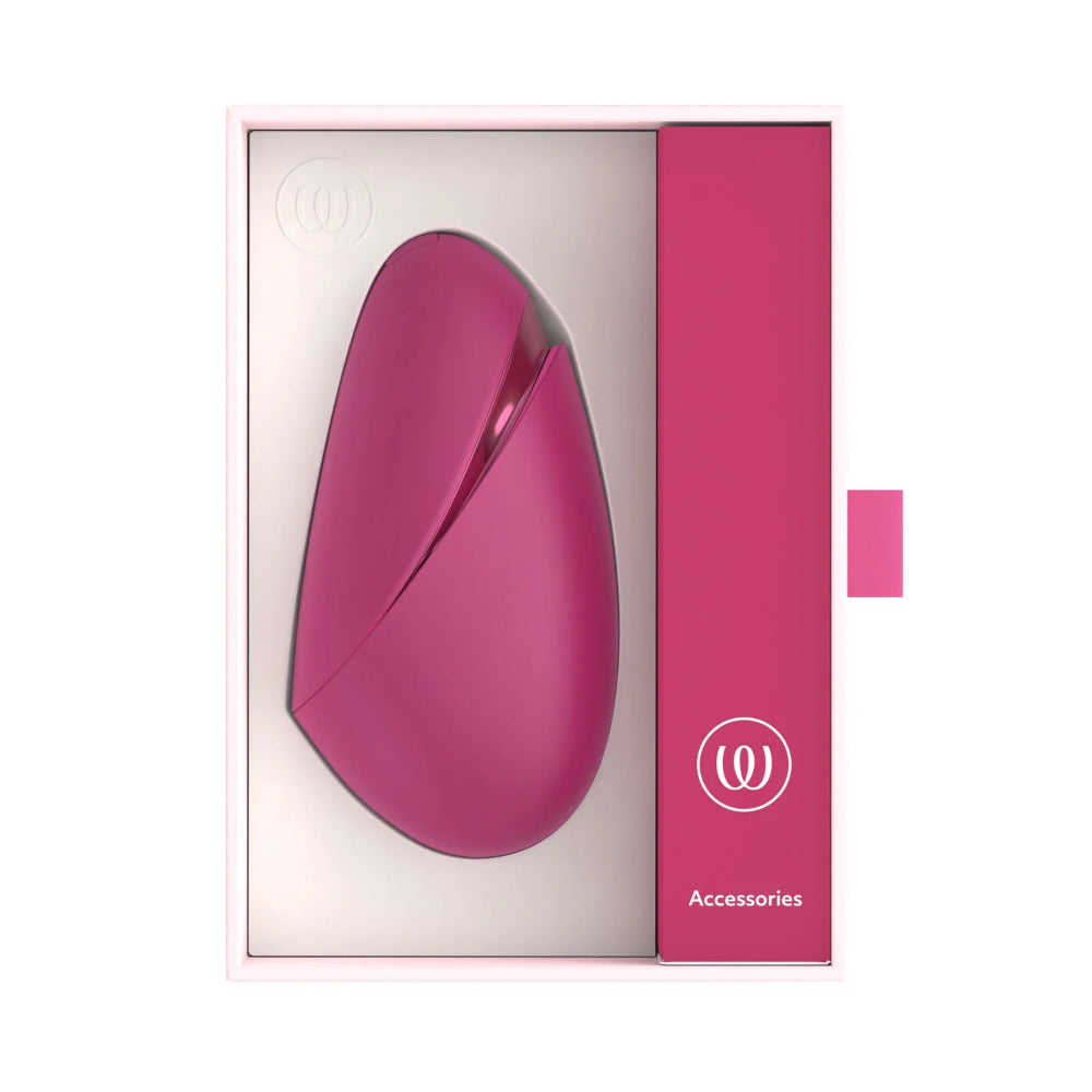 Womanizer Next Liberty displayed beside its premium retail box and branded packaging.